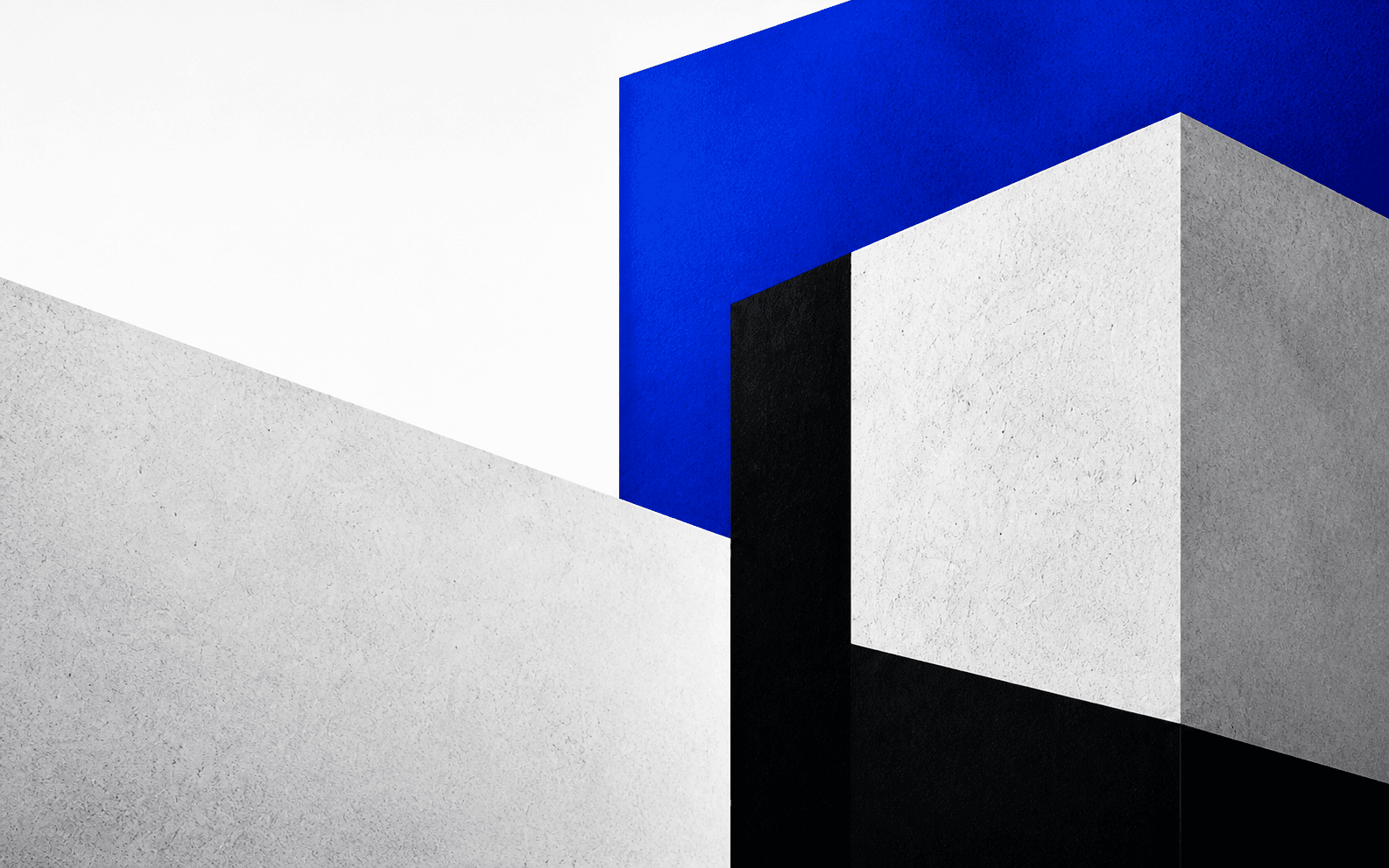 Abstract aerial-like composition of white, black and cobalt architectural planes