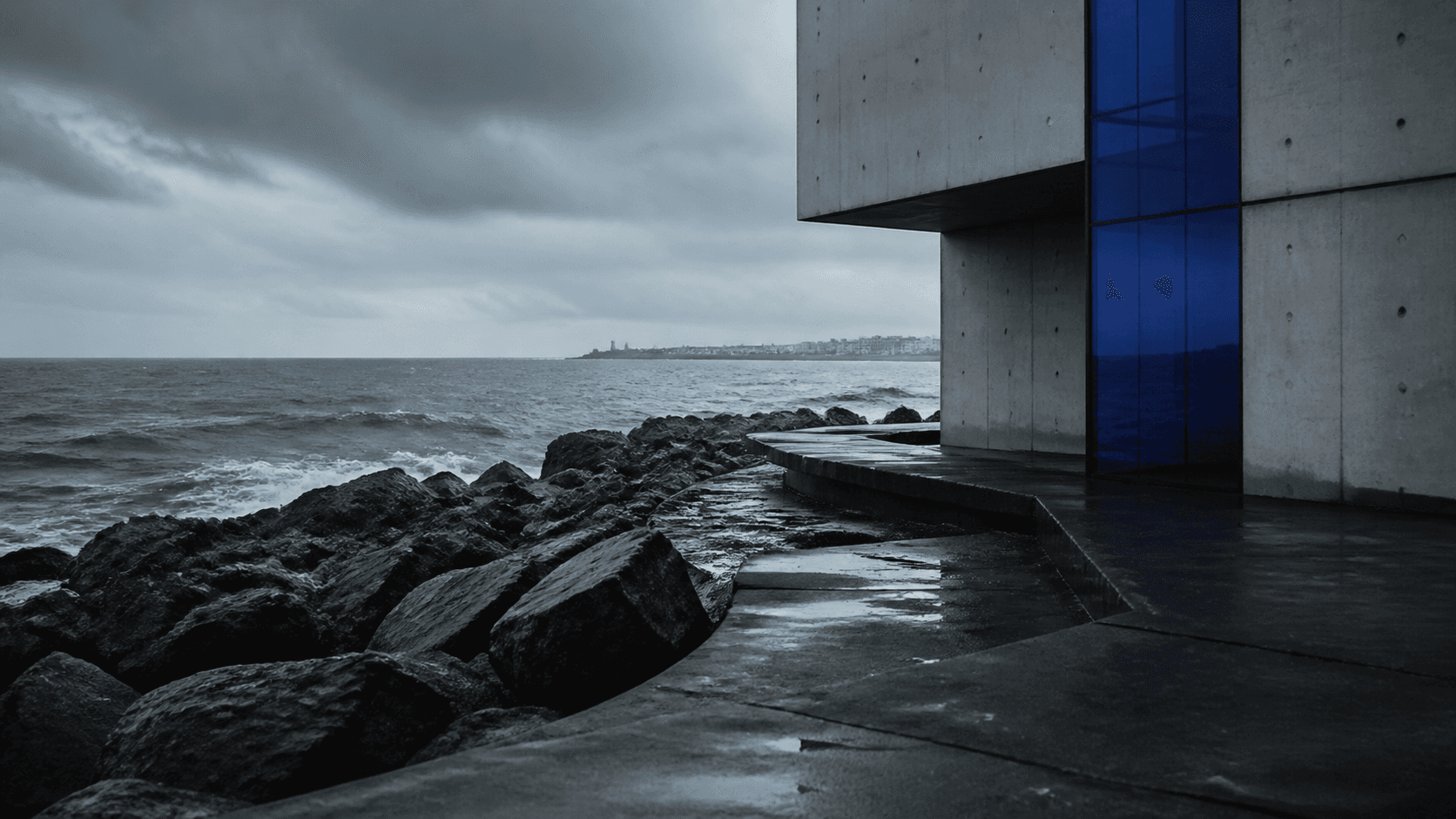 Cinematic coastal architecture in cool gray and cobalt blue