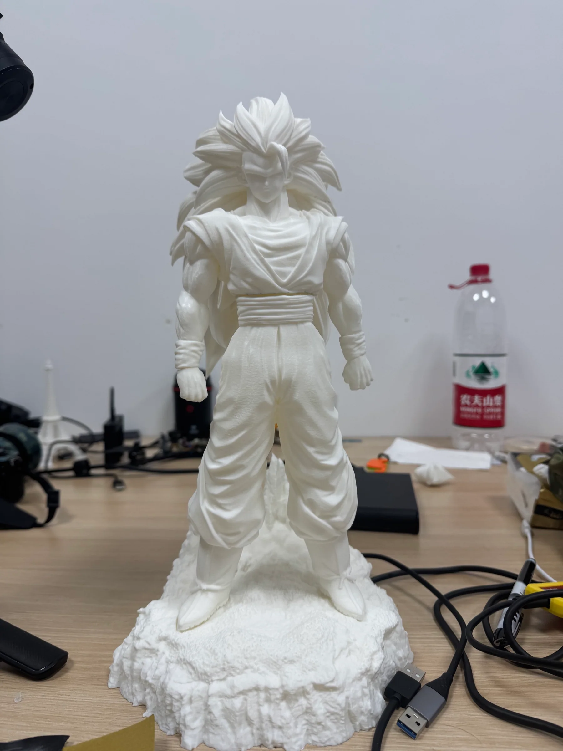 Large white 3D printed anime character figure standing on a textured base